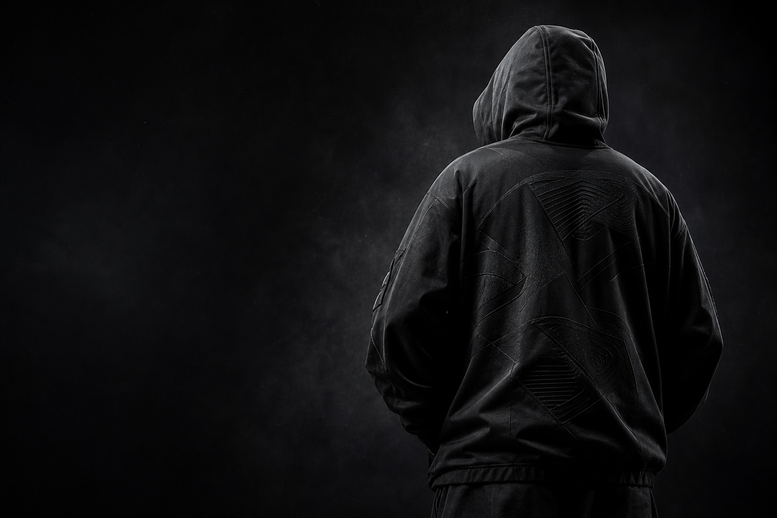 Model wearing an oversized black Blvck Threads jacket