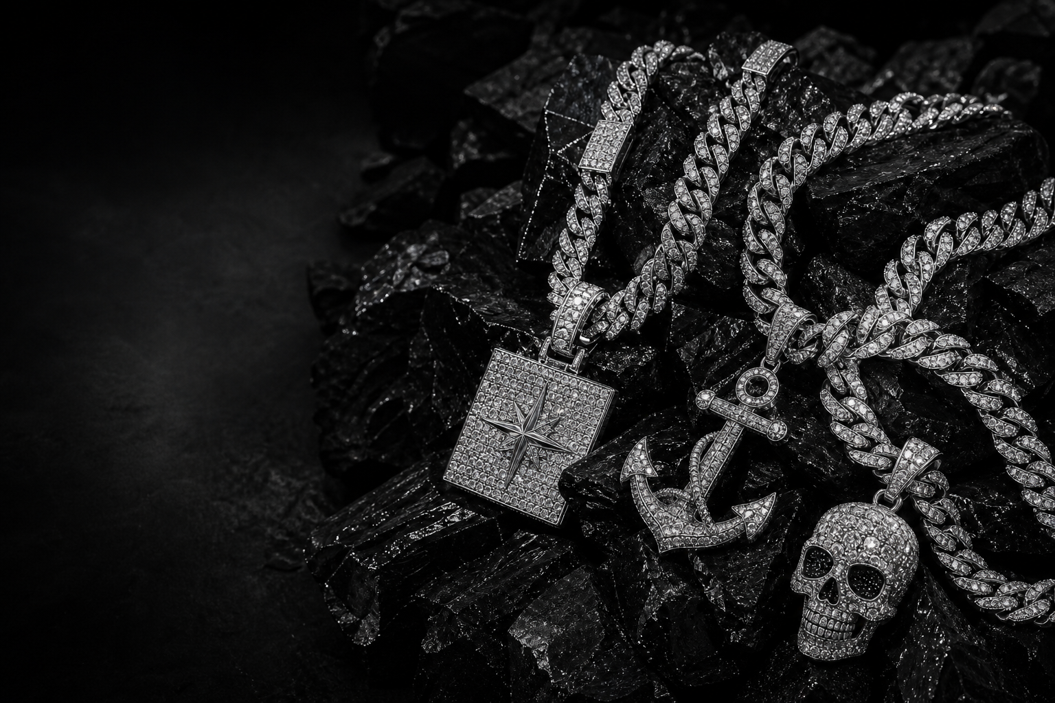 Diamond chains and iced-out jewelry on black rocks